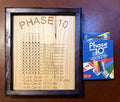 Phase 10 Score Board with cards and pegs